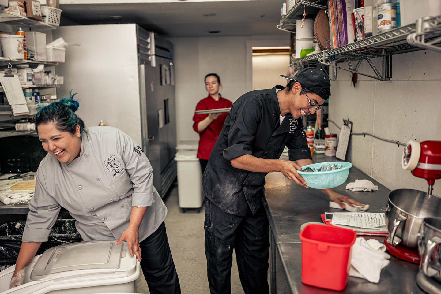 two workers in a kitchen wearing stain resistant fabric